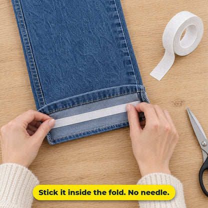 Sticking hem tape inside the fold of a jeans hem