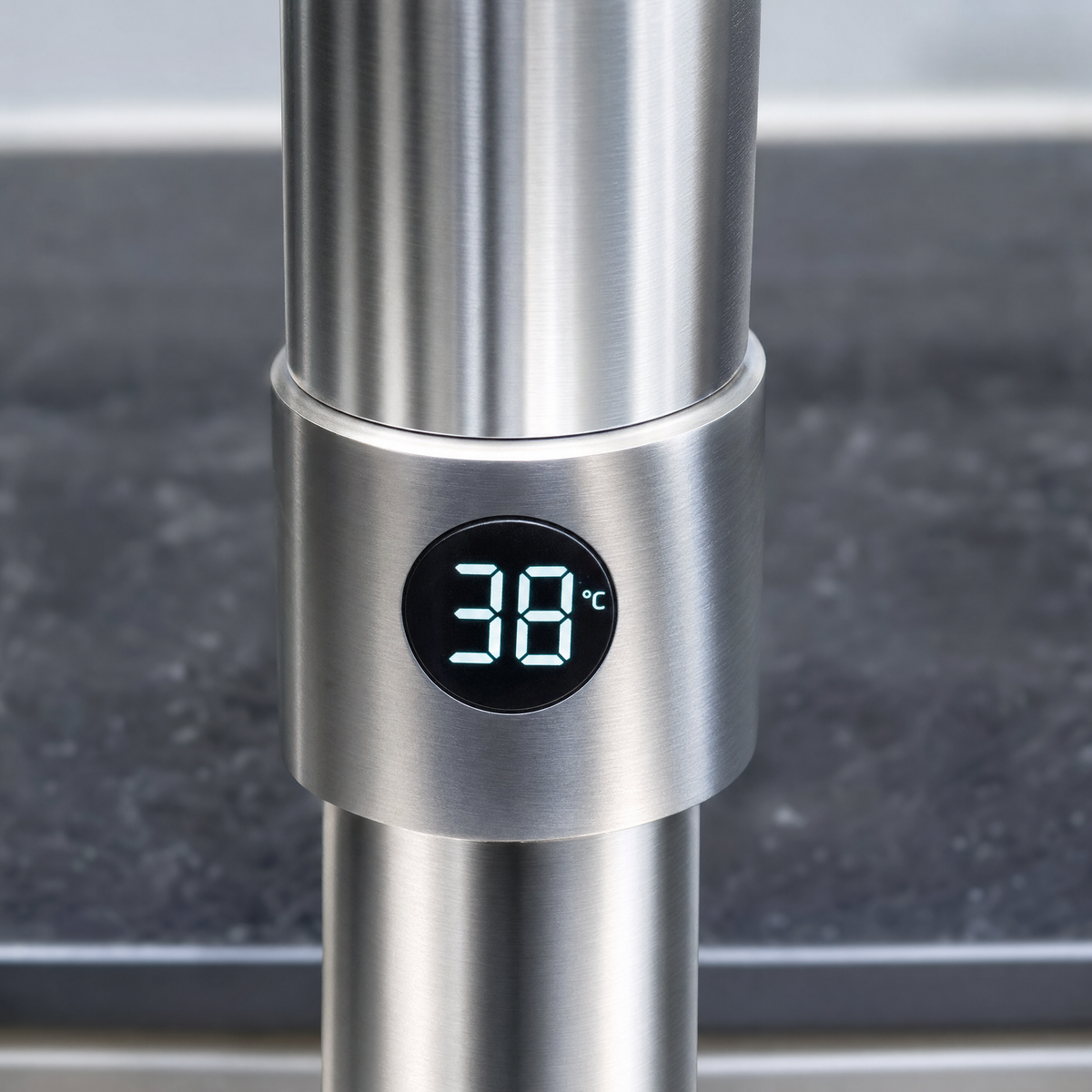 Close-up of the digital temperature display at the spout base showing 38 degrees Celsius